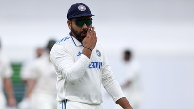 India's captain Rohit Sharma walks back at the lunch break on day two of the third cricket Test match between Australia and India at The Gabba in Brisbane (AFP) India's captain Rohit Sharma walks back at the lunch break on day two of the third cricket Test match between Australia and India at The Gabba in Brisbane (AFP)