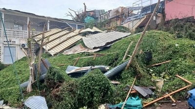 This photograph shows a pile of debris of metal sheets, wood and unrooted trees after the cyclone Chido hit France's Indian Ocean territory of Mayotte. (AFP) This photograph shows a pile of debris of metal sheets, wood and unrooted trees after the cyclone Chido hit France's Indian Ocean territory of Mayotte. (AFP)