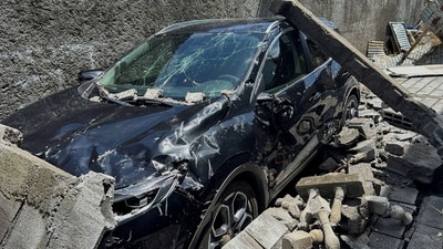 The wreckage of a car lies outside a home, in the aftermath of Cyclone Chido, within Labattoir, in Mayotte, (REUTERS)