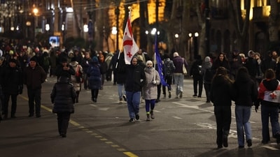 Anti-government demonstrators protest outside the Georgian parliament after the parliament members elected a new president, in Tbilisi on December 15, 2024. An electoral college, controlled by the ruling Georgian Dream party and which is boycotted by the opposition, elected Mikheil Kavelashvili with 224 votes as the country's next President for a five-year term. The opposition has denounced the December 14 election as "illegitimate" and said the sitting president, Salome Zurabishvili remains the country's sole legitimate leader. (Photo by Giorgi ARJEVANIDZE / AFP) (AFP) Anti-government demonstrators protest outside the Georgian parliament after the parliament members elected a new president, in Tbilisi on December 15, 2024. An electoral college, controlled by the ruling Georgian Dream party and which is boycotted by the opposition, elected Mikheil Kavelashvili with 224 votes as the country's next President for a five-year term. The opposition has denounced the December 14 election as "illegitimate" and said the sitting president, Salome Zurabishvili remains the country's sole legitimate leader. (Photo by Giorgi ARJEVANIDZE / AFP) (AFP)