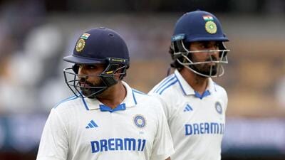 India skipper Rohit Sharma and KL Rahul walk off as play is finally called off due to bad light on the rain-hit Day 3 of the Brisbane Test against Australia. (AFP) India skipper Rohit Sharma and KL Rahul walk off as play is finally called off due to bad light on the rain-hit Day 3 of the Brisbane Test against Australia. (AFP)