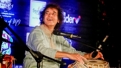 FILE: Ustad Zakir Hussain performs during the 100th birth anniversary of his father Ustad Alla Rakha, in Ahmedabad. (PTI)