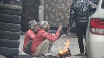 People gather around a bonfire on a cold morning in New Delhi. (Arvind Yadav/ HT Photo) People gather around a bonfire on a cold morning in New Delhi. (Arvind Yadav/ HT Photo)