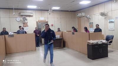 The entire staff, following the CEO’s directions, attended to the visitors while standing next to their chairs for 20 minutes as a punishment for negligence. (HT Photos) The entire staff, following the CEO’s directions, attended to the visitors while standing next to their chairs for 20 minutes as a punishment for negligence. (HT Photos)