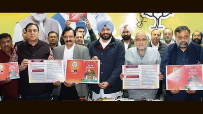Union minister Ravneet Singh Bittu (centre) with other senior BJP leaders releasing the party’s manifesto for the MC elections in Ludhiana on Monday. (HT Photo) Union minister Ravneet Singh Bittu (centre) with other senior BJP leaders releasing the party’s manifesto for the MC elections in Ludhiana on Monday. (HT Photo)