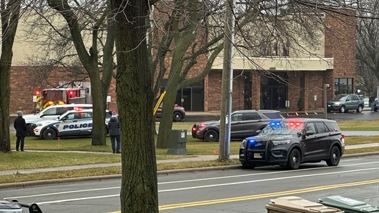 Emergency vehicles are parked outside the Abundant Life Christian School in Madison, Wis., where multiple injuries were reported following a shooting, Monday, Dec. 16, 2024. (AP Photo/Scott Bauer) (AP)