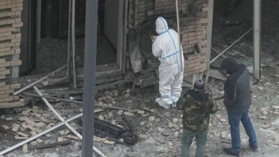 Investigators work near a scooter at the place where Lt. General Igor Kirillov, the head of Russia's Nuclear, Biological, and Chemical Defence Forces and his assistant Ilya Polikarpov were killed by an explosive device planted close to a residential apartment's block in Moscow, Russia, Tuesday, Dec. 17, 2024. (AP)