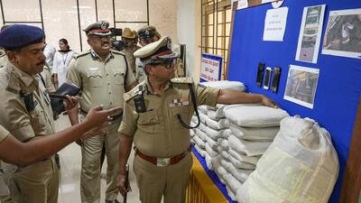 Bengaluru city police commissioner B Dayananda inspects the seized articles during a press conference on Tuesday. (PTI) Bengaluru city police commissioner B Dayananda inspects the seized articles during a press conference on Tuesday. (PTI)