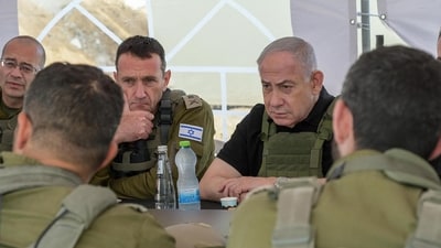 This handout picture released by the Government Press Office (GPO) shows Israel's Prime Minister Benjamin Netanyahu (R), Defence Minister Israel Katz (R) and army Chief-of-Staff Herzi Halevi (2nd L) during a briefing in the Netzarim Corridor, on November 19, 2024. (AFP) This handout picture released by the Government Press Office (GPO) shows Israel's Prime Minister Benjamin Netanyahu (R), Defence Minister Israel Katz (R) and army Chief-of-Staff Herzi Halevi (2nd L) during a briefing in the Netzarim Corridor, on November 19, 2024. (AFP)