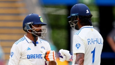 Ravindra Jadeja (L) and KL Rahul bump gloves between the overs on day four of the third cricket Test match between Australia and India. (AFP) Ravindra Jadeja (L) and KL Rahul bump gloves between the overs on day four of the third cricket Test match between Australia and India. (AFP)