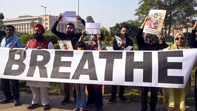 People demand government action over the rise in air pollution in Delhi. (ANI Photo) People demand government action over the rise in air pollution in Delhi. (ANI Photo)
