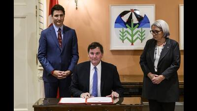 Prime Minister Justin Trudeau (left) and Gov. Gen. Mary Simon look on as Dominic LeBlanc (centre), Minister of Finance, Public Safety and Intergovernmental Affairs, participates in a signing during a swearing in ceremony at Rideau Hall in Ottawa, on Monday. (AP) Prime Minister Justin Trudeau (left) and Gov. Gen. Mary Simon look on as Dominic LeBlanc (centre), Minister of Finance, Public Safety and Intergovernmental Affairs, participates in a signing during a swearing in ceremony at Rideau Hall in Ottawa, on Monday. (AP)