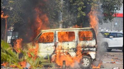The car set on fire near Sohna Chowk on Monday (Parveen Kumar/HT Photo) The car set on fire near Sohna Chowk on Monday (Parveen Kumar/HT Photo)