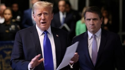Former U.S. President Donald Trump, alongside his attorney Todd Blanche, speaks to the media as he arrives for his criminal trial for allegedly covering up hush money payments at Manhattan Criminal Court on May 30, 2024 in New York City. (via REUTERS / Michael M. Santiago/Pool)