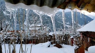An area surrounding houses is covered in snow as Gurez Valley receives snowfall, in Bandipora on Sunday. (ANI) An area surrounding houses is covered in snow as Gurez Valley receives snowfall, in Bandipora on Sunday. (ANI)