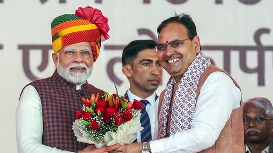 Prime Minister Narendra Modi being felicitated by Rajasthan Chief Minister Bhajan Lal Sharma during the ‘Ek Varsh-Parinaam Utkarsh’: Completion of 1 year of State Government of Rajasthan’ programme, in Jaipur on Tuesday. (ANI)