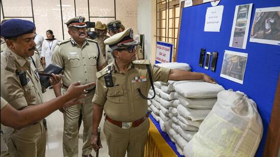 Bengaluru city police commissioner B Dayananda inspects the seized articles during a press conference on Tuesday. (PTI)