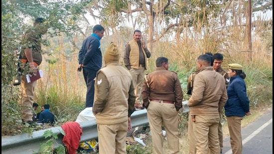 The trolley bag was spotted by some locals on Tuesday morning and they informed the Niwari police station. The police said locals got alarmed when they spotted several stray dogs attacking the bag and went to have a look. (HT Photos)