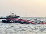 A boat carrying 85 passengers capsizes near the Gateway of India, in Mumbai on Wednesday.