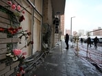 Flowers are attached to the facade of an apartment block in Moscow, Russia, on Wednesday, Dec. 18, 2024, where a bomb killed Lt. Gen. Igor Kirillov, the head of Russia's Radiation, Biological, and Chemical Defense Forces, and his assistant, Ilya Polikarpov. Flowers are attached to the facade of an apartment block in Moscow, Russia, on Wednesday, Dec. 18, 2024, where a bomb killed Lt. Gen. Igor Kirillov, the head of Russia's Radiation, Biological, and Chemical Defense Forces, and his assistant, Ilya Polikarpov.