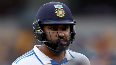 India's captain Rohit Sharma reacts as he walks off the ground due to bad light on day three of the third cricket Test match between Australia and India at The Gabba in Brisbane (AFP) India's captain Rohit Sharma reacts as he walks off the ground due to bad light on day three of the third cricket Test match between Australia and India at The Gabba in Brisbane (AFP)