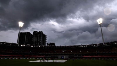 Tea was called for as the players went off and soon, heavy rains engulfed the Gabba. The two sides eventually shook hands. (AFP) Tea was called for as the players went off and soon, heavy rains engulfed the Gabba. The two sides eventually shook hands. (AFP)
