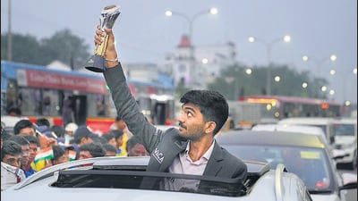 D Gukesh poses with trophy during a procession held to honour him on becoming the youngest world chess champion in Chennai. (AP)
