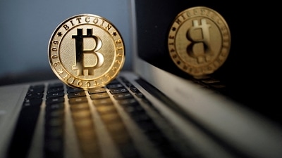 A bitcoin is seen in an illustration picture taken at La Maison du Bitcoin in Paris, France, June 23, 2017. REUTERS/Benoit Tessier/File Photo