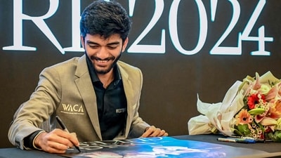 World chess champion Gukesh Dommaraju signs an autograph during a meet and greet session in Singapore after becoming the youngest undisputed world chess champion on December 12. (AFP) World chess champion Gukesh Dommaraju signs an autograph during a meet and greet session in Singapore after becoming the youngest undisputed world chess champion on December 12. (AFP)