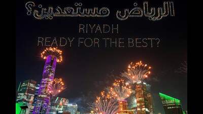TOPSHOT - A drone-created light show and fireworks illuminate the sky over Riyadh on December 11, 2024, celebrating Saudi Arabia’s confirmation as the host of the 2034 FIFA World Cup football tournament. (Photo by Haitham EL-TABEI / AFP) (AFP) TOPSHOT - A drone-created light show and fireworks illuminate the sky over Riyadh on December 11, 2024, celebrating Saudi Arabia’s confirmation as the host of the 2034 FIFA World Cup football tournament. (Photo by Haitham EL-TABEI / AFP) (AFP)