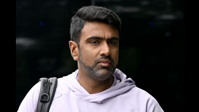 TOPSHOT - This picture taken on December 1, 2024 shows India's spin bowler Ravichandran Ashwin arriving to attend a cricket warm-up session at Manuka Oval in Canberra. (Photo by Saeed KHAN / AFP) (AFP) TOPSHOT - This picture taken on December 1, 2024 shows India's spin bowler Ravichandran Ashwin arriving to attend a cricket warm-up session at Manuka Oval in Canberra. (Photo by Saeed KHAN / AFP) (AFP)