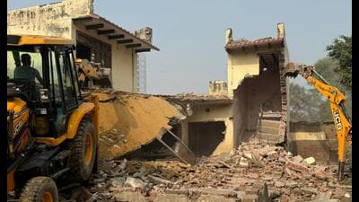 The Gurugram Metropolitan Development Authority (GMDA) on Tuesday demolished 10 illegal but permanent structures along the Southern Peripheral Road at Ram Bir ki Dhani in Gurugram. (HT PHOTO)