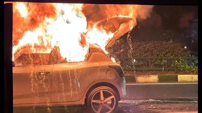 The Maruti Suzuki Swift which caught fire near Cheema Boilers on Tuesday night. (HT Photo)