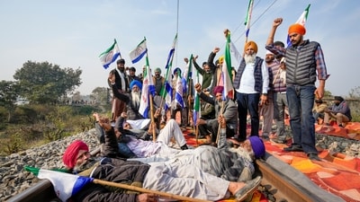 Farmers block railway tracks as part of their state-wide 'Rail Roko' protest to press the Centre into accepting their various demands, including a legally binding minimum support price for crops, on the outskirts of Amritsar, Wednesday, Dec. 18, 2024. (PTI) Farmers block railway tracks as part of their state-wide 'Rail Roko' protest to press the Centre into accepting their various demands, including a legally binding minimum support price for crops, on the outskirts of Amritsar, Wednesday, Dec. 18, 2024. (PTI)