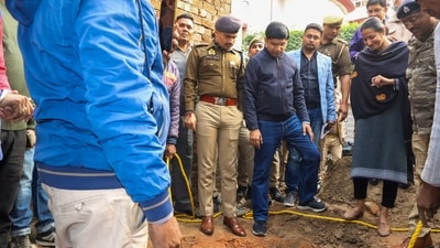 Police personnel and others stand near a well found inside a recently-opened temple, in Sambhal, Uttar Pradesh, Sunday, Dec. 15, 2024. (PTI) Police personnel and others stand near a well found inside a recently-opened temple, in Sambhal, Uttar Pradesh, Sunday, Dec. 15, 2024. (PTI)