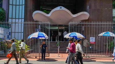 People walk past the Bombay Stock Exchange (BSE) building, in Mumbai, Thursday, Oct. 3, 2024. (PTI) People walk past the Bombay Stock Exchange (BSE) building, in Mumbai, Thursday, Oct. 3, 2024. (PTI)