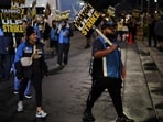 A historic Amazon workers' strike began today, coinciding with the holiday rush, potentially affecting deliveries nationwide as workers demand better conditions and fair wages.
REUTERS/Daniel Cole
