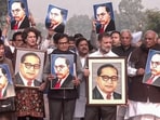 Leader of Opposition in Rajya Sabha Mallikarjun Kharge, Leader of Opposition in Lok Sabha Rahul Gandhi, Congress MPs Priyanka Gandhi Vadra, Selja Kumari, Samajwadi Party (SP) MP Ram Gopal Yadav and Opposition MPs hold portraits of BR Ambedkar during their protest against Amit Shah's remarks in New Delhi on December 18. Leader of Opposition in Rajya Sabha Mallikarjun Kharge, Leader of Opposition in Lok Sabha Rahul Gandhi, Congress MPs Priyanka Gandhi Vadra, Selja Kumari, Samajwadi Party (SP) MP Ram Gopal Yadav and Opposition MPs hold portraits of BR Ambedkar during their protest against Amit Shah's remarks in New Delhi on December 18.
