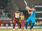 India's batter Smriti Mandhana plays a shot.
