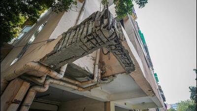 A damaged section of a building of Signature View Apartments at Mukherjee Nagar in New Delhi on Wednesday. (Sanchit Khanna/HT PHOTO)