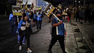 A historic Amazon workers' strike began today, coinciding with the holiday rush, potentially affecting deliveries nationwide as workers demand better conditions and fair wages.
REUTERS/Daniel Cole (REUTERS)