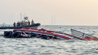 A boat carrying 85 passengers capsizes near the Gateway of India, in Mumbai on Wednesday. (Indian Coast Guard) A boat carrying 85 passengers capsizes near the Gateway of India, in Mumbai on Wednesday. (Indian Coast Guard)