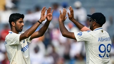 India's Washington Sundar celebrates a wicket with his Ravichandran Ashwin (R). (AFP)