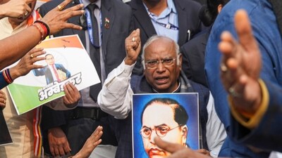 Congress president Mallikarjun Kharge take part in a protest march demanding an apology and resignation of Union Home Minister Amit Shah over his remarks on Babasaheb Ambedkar, at Parliament complex, in New Delhi, Thursday, Dec. 19, 2024. (PTI) Congress president Mallikarjun Kharge take part in a protest march demanding an apology and resignation of Union Home Minister Amit Shah over his remarks on Babasaheb Ambedkar, at Parliament complex, in New Delhi, Thursday, Dec. 19, 2024. (PTI)