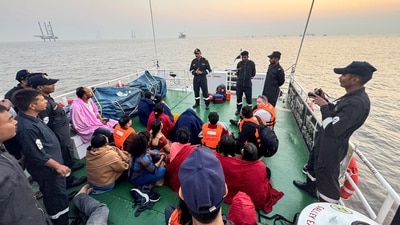 Indian Coast Guard rescuing people after a boat capsized near the Gateway of India, in Mumbai. (Indian Coast Guard) Indian Coast Guard rescuing people after a boat capsized near the Gateway of India, in Mumbai. (Indian Coast Guard)