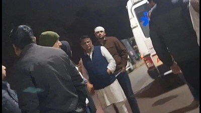 OP Dhankar and his son Ashutosh (with bandage on his head) outside the civil hospital in Panchkula on Wednesday. (HT Photo) OP Dhankar and his son Ashutosh (with bandage on his head) outside the civil hospital in Panchkula on Wednesday. (HT Photo)