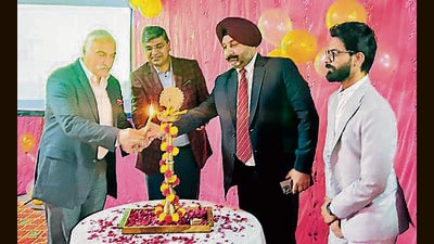 Officials lighting a lamp at the event in Ludhiana on Thursday. (HT Photo)