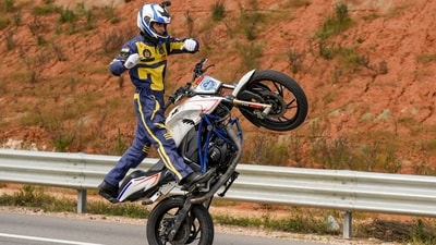 Sumit Tomar, a member of the Army Service Corps (ASC) 'Tornadoes' of the Indian Army, rides a motorcycle in an attempt to break the world record for the 'longest no-hands motorcycle wheelie', in Bengaluru, Karnataka. (PTI) Sumit Tomar, a member of the Army Service Corps (ASC) 'Tornadoes' of the Indian Army, rides a motorcycle in an attempt to break the world record for the 'longest no-hands motorcycle wheelie', in Bengaluru, Karnataka. (PTI)