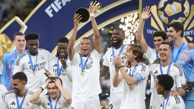 Real Madrid's Kylian Mbappe, center, lifts the trophy after winning the Intercontinental Cup soccer final match against CF Pachuca at the Lusail Stadium in Lusail, Qatar, Wednesday, Dec. 18, 2024. Real Madrid won the game 3-0.(AP Photo/Hussein Sayed) (AP) Real Madrid's Kylian Mbappe, center, lifts the trophy after winning the Intercontinental Cup soccer final match against CF Pachuca at the Lusail Stadium in Lusail, Qatar, Wednesday, Dec. 18, 2024. Real Madrid won the game 3-0.(AP Photo/Hussein Sayed) (AP)