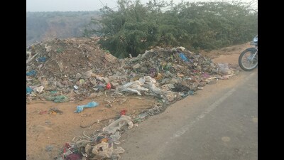 Waste dumped on Nuh-Tauru road in the Aravalli region on Thursday. (HT PHOTO) Waste dumped on Nuh-Tauru road in the Aravalli region on Thursday. (HT PHOTO)